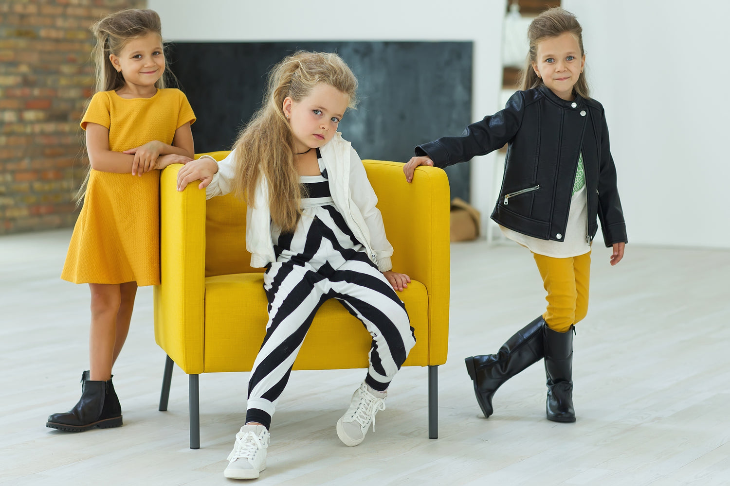 3 baby girl wearing clothes