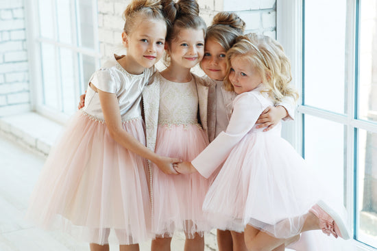 4 baby girls wearing frock